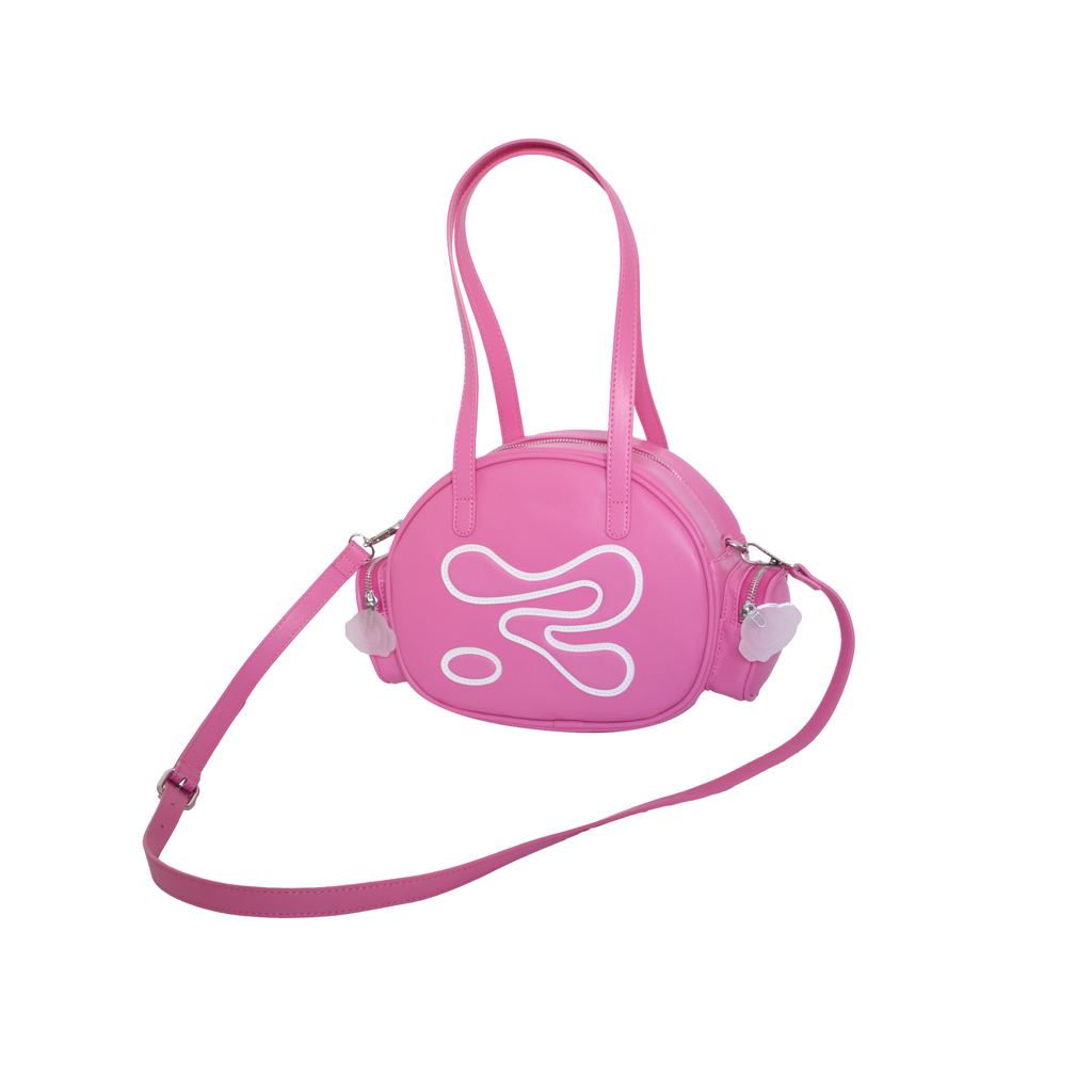 Pink round handbag with a strap on a white background